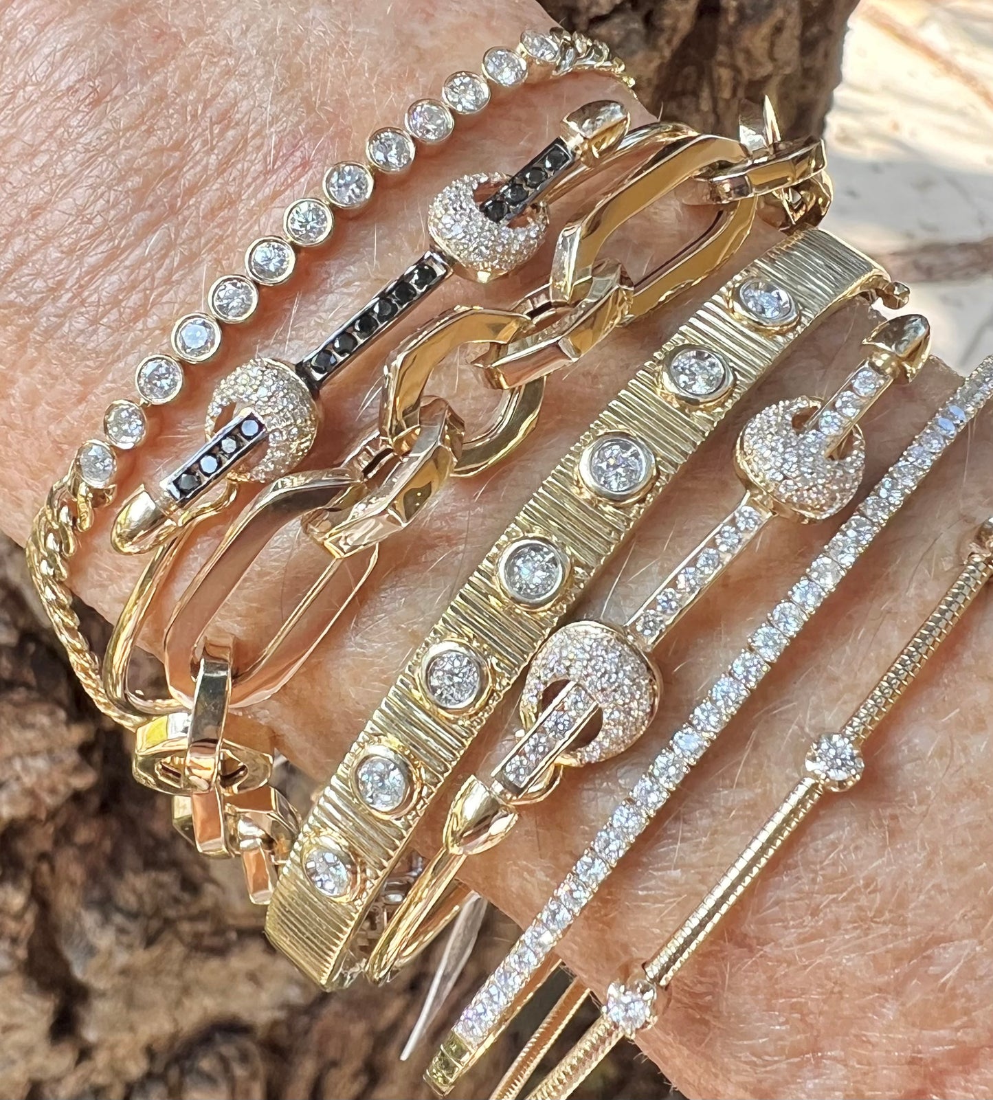 Bar wire bangle with two diamond knots