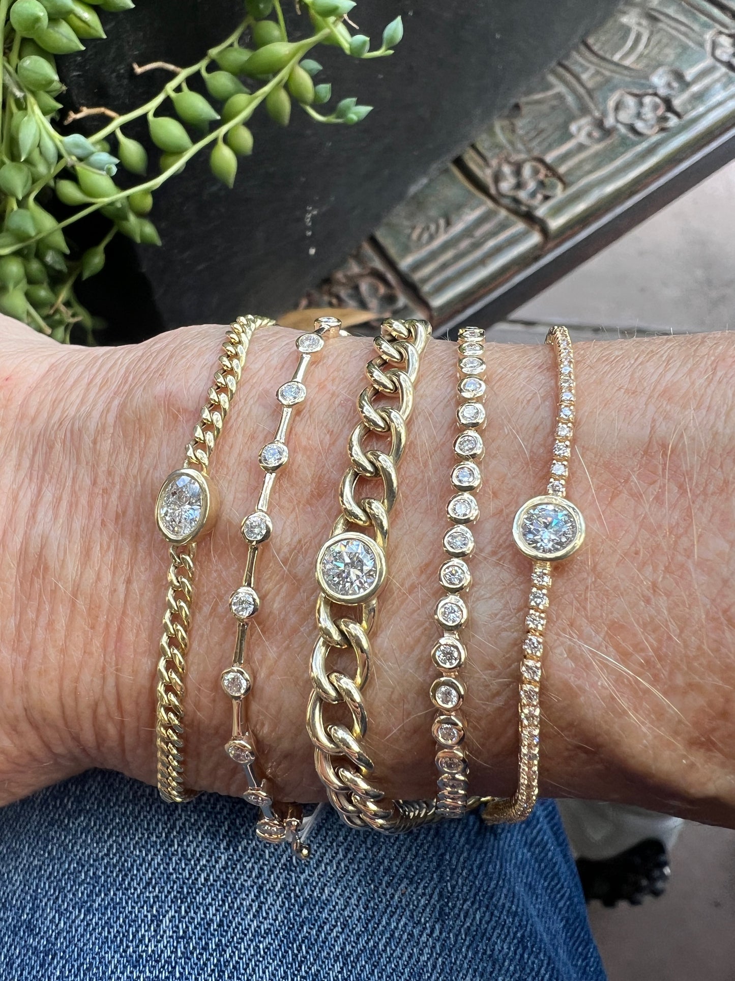 Bezel set round diamond on pave chain bracelet