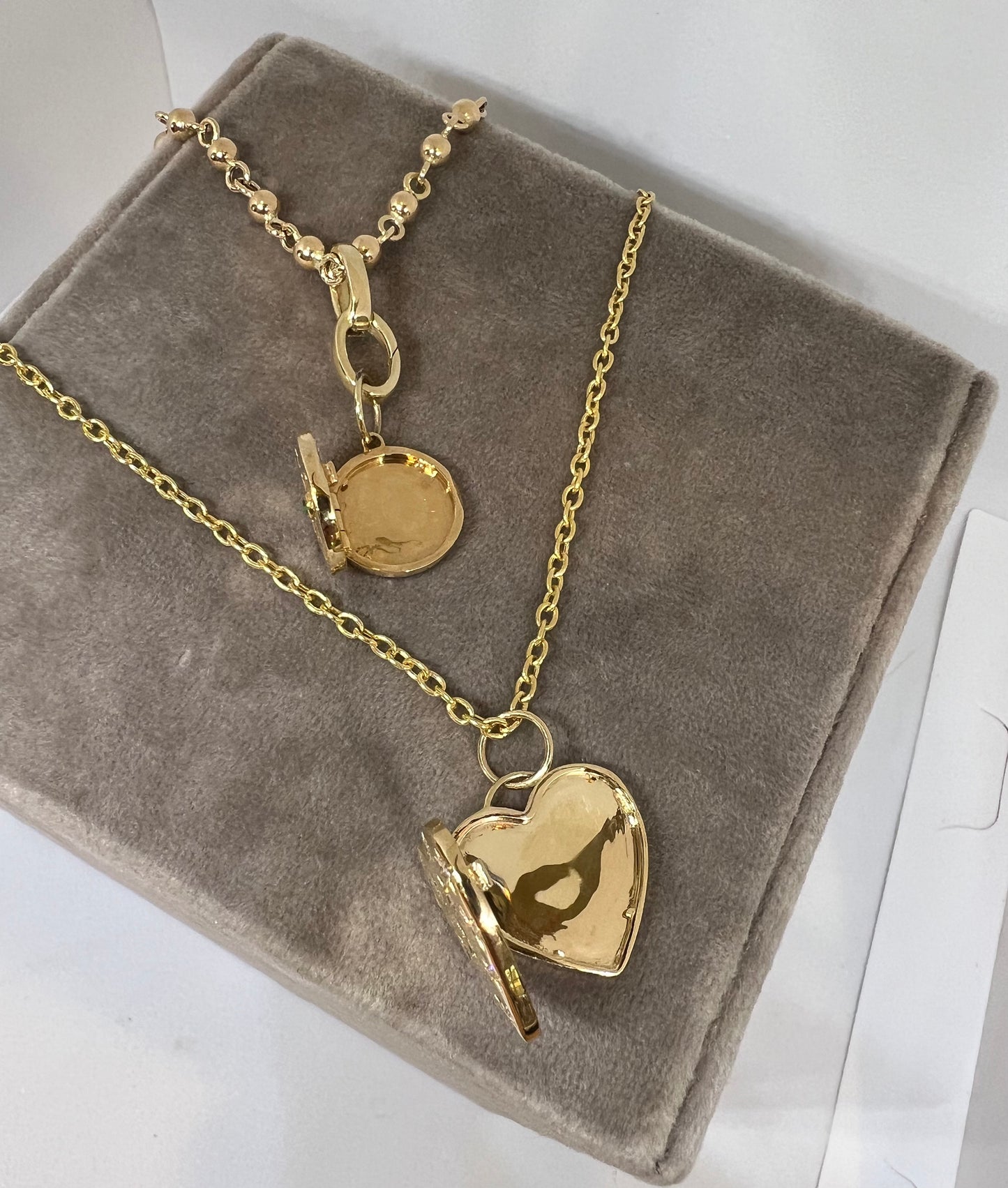 Round diamond and emerald locket