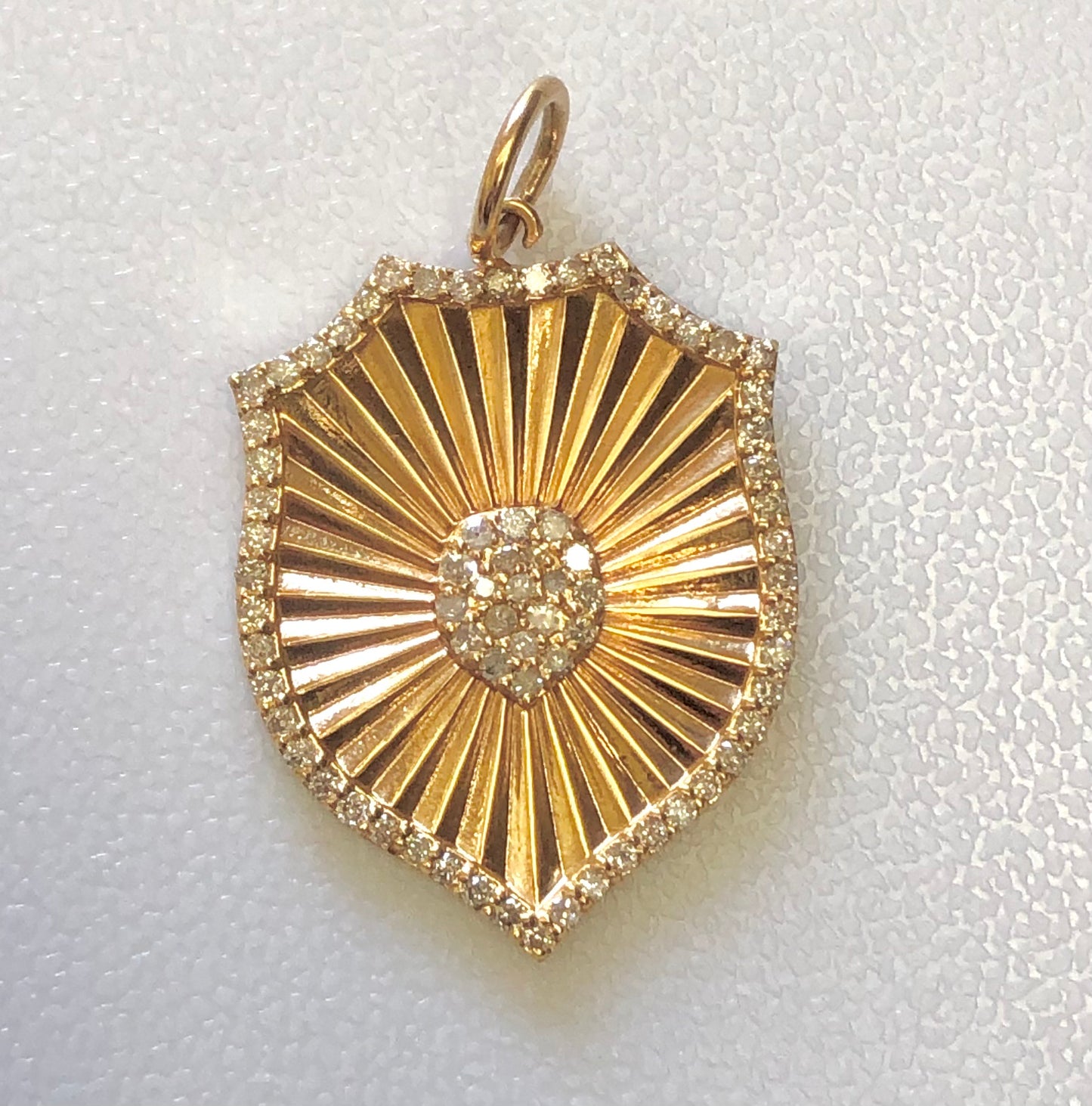 Gold shield charm