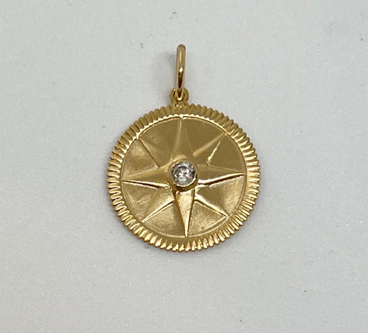 Gold and diamond compass star medallion